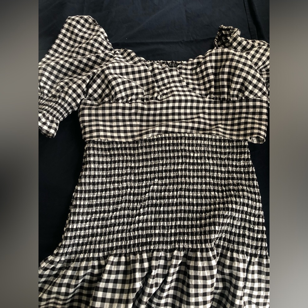 The shirt is medium and the skirt is extra large skirt and shirt set
